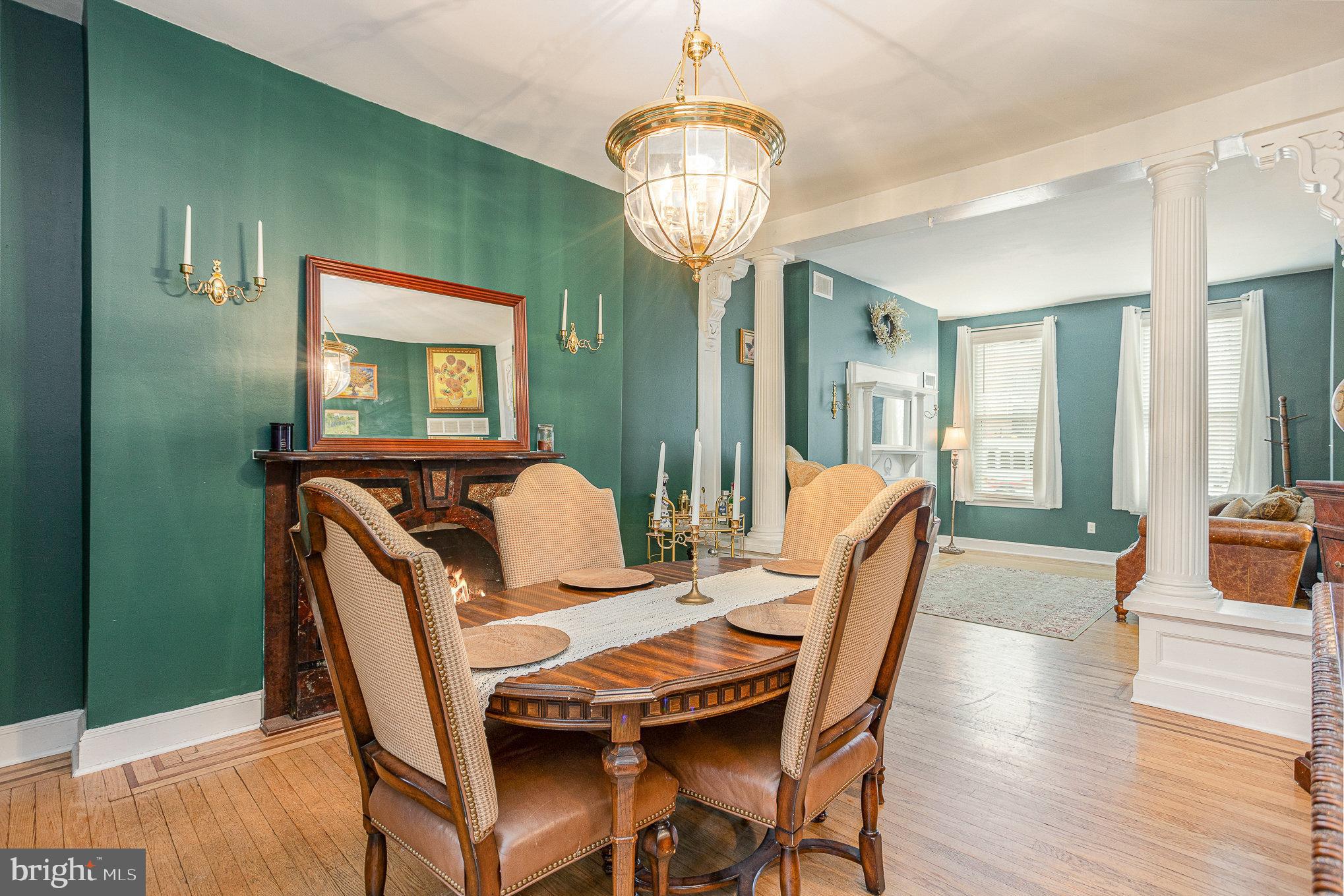 604 Washington Boulevard Baltimore, MD 21230 - Photo 7 of 30 a view of a dining room with furniture wooden floor and chandelier