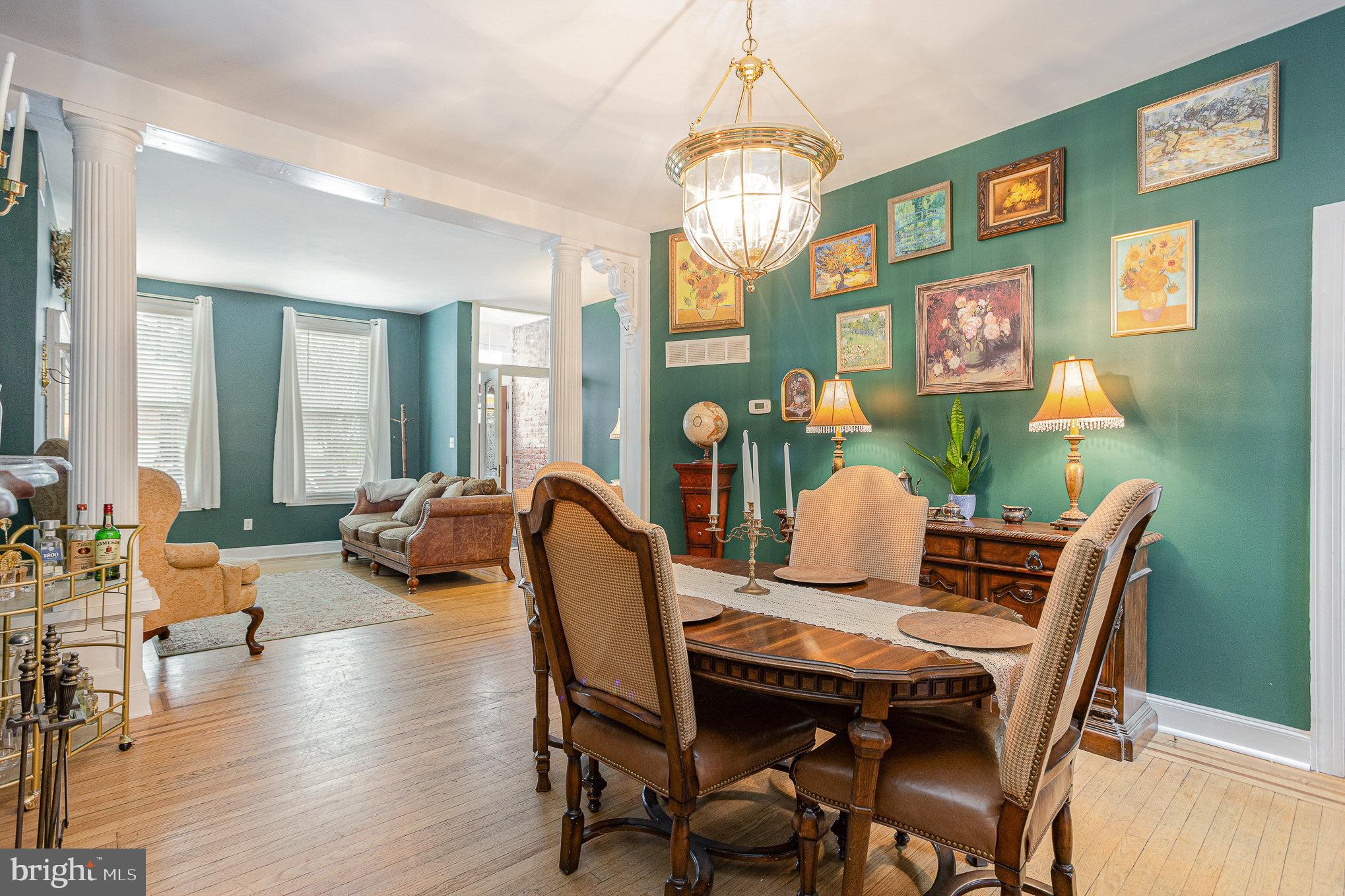 604 Washington Boulevard Baltimore, MD 21230 - Photo 8 of 30 a view of a dining room with furniture a chandelier and wooden floor