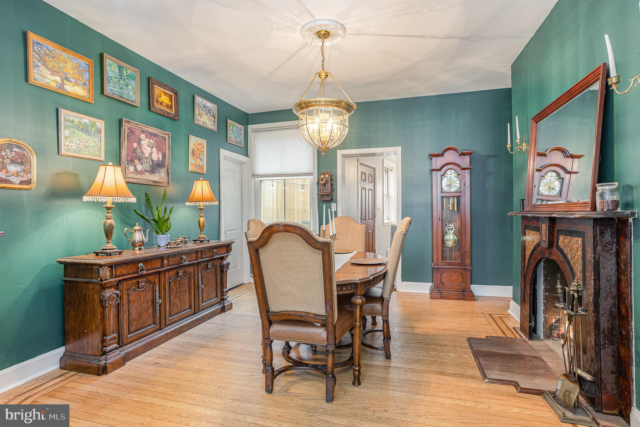 604 Washington Boulevard Baltimore, MD 21230 - Photo 9 of 30 a view of a dining room with furniture wooden floor and a chandelier