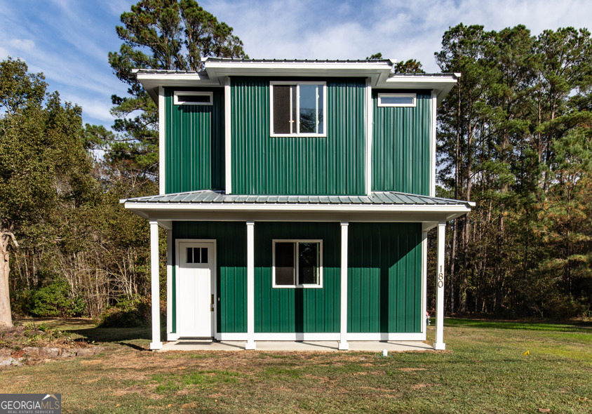 front view of a house with a small yard