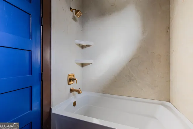 a bathroom with a bathtub