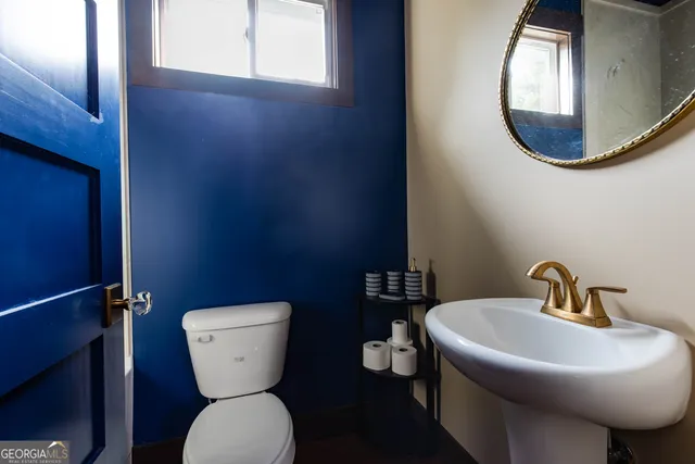 a bathroom with a toilet and a sink