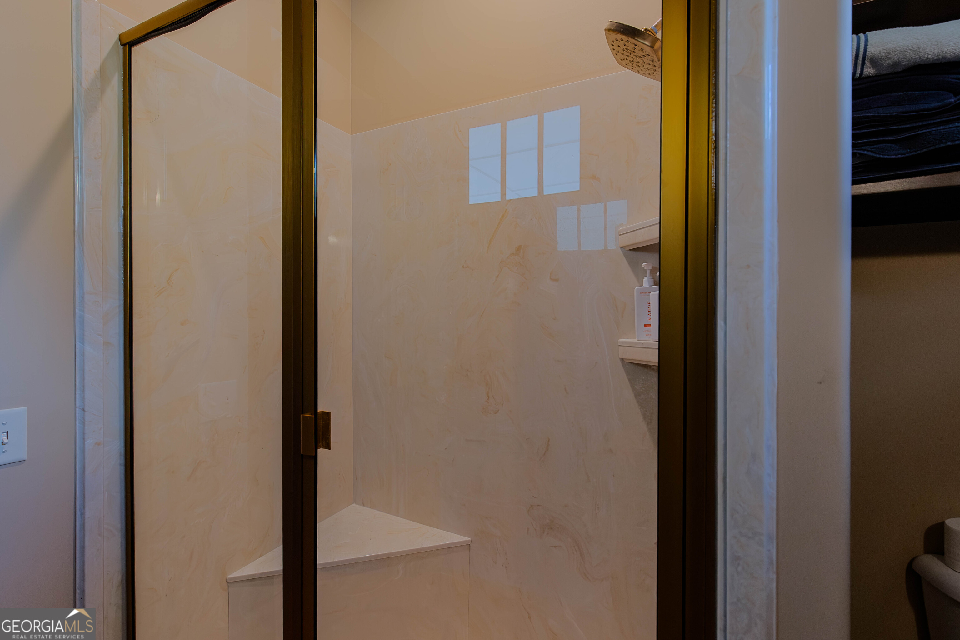 180 South Main Street Ludowici, GA 31316 - Photo 18 of 43 a bathroom with a glass shower door