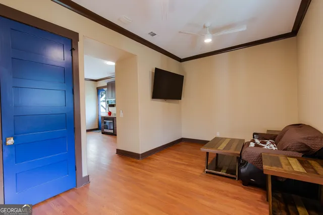 a livingroom with furniture and a flat screen tv