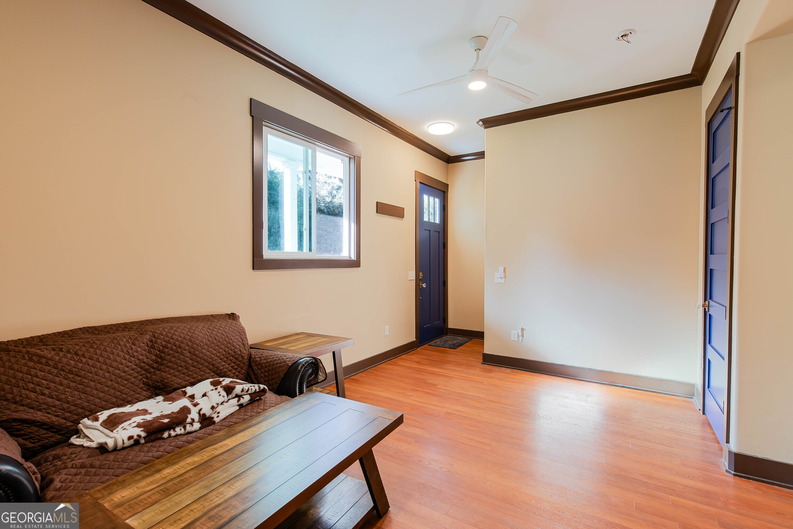 180 South Main Street Ludowici, GA 31316 - Photo 21 of 43 a living room with furniture and wooden floor
