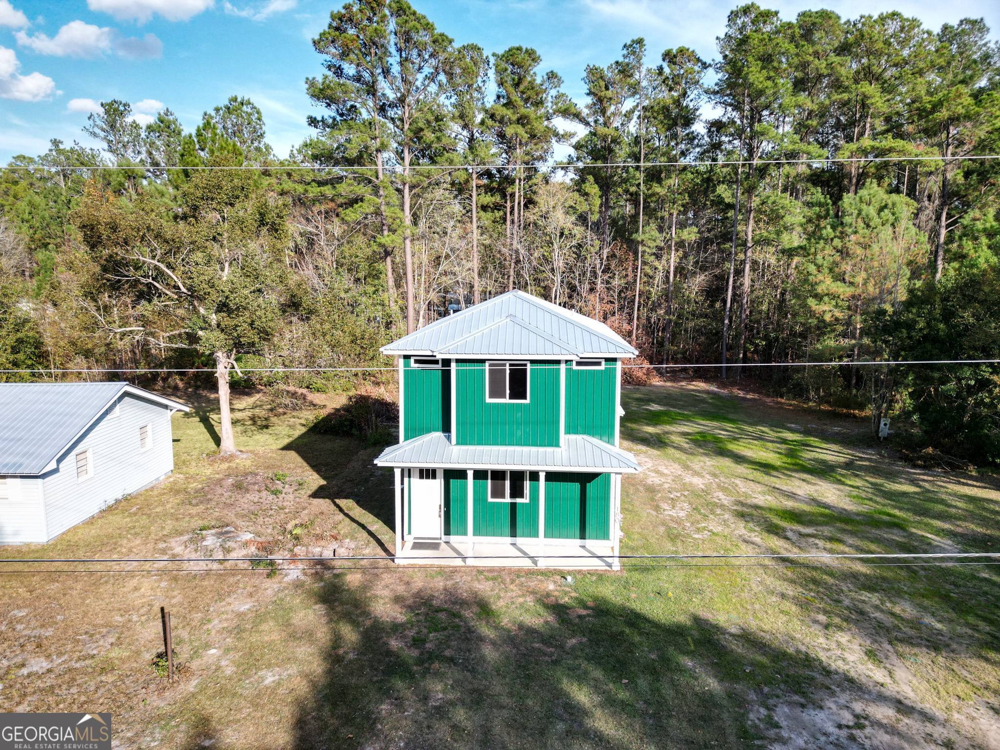 180 South Main Street Ludowici, GA 31316 - Photo 24 of 43 a front view of a house with a yard