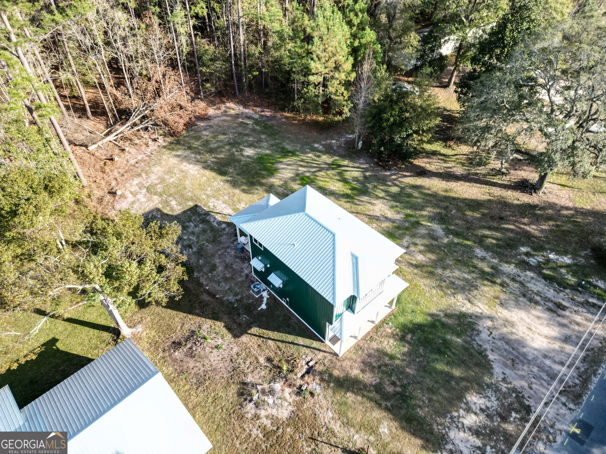 180 South Main Street Ludowici, GA 31316 - Photo 28 of 43 a view of a yard with plants
