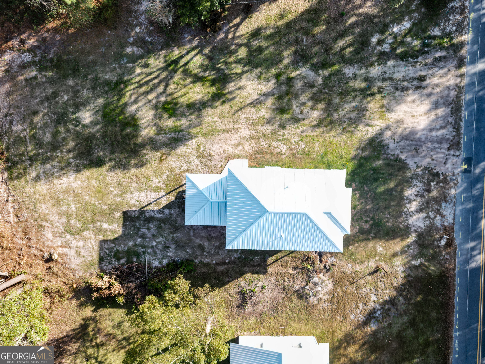 180 South Main Street Ludowici, GA 31316 - Photo 29 of 43 an aerial view of house with yard and outdoor seating