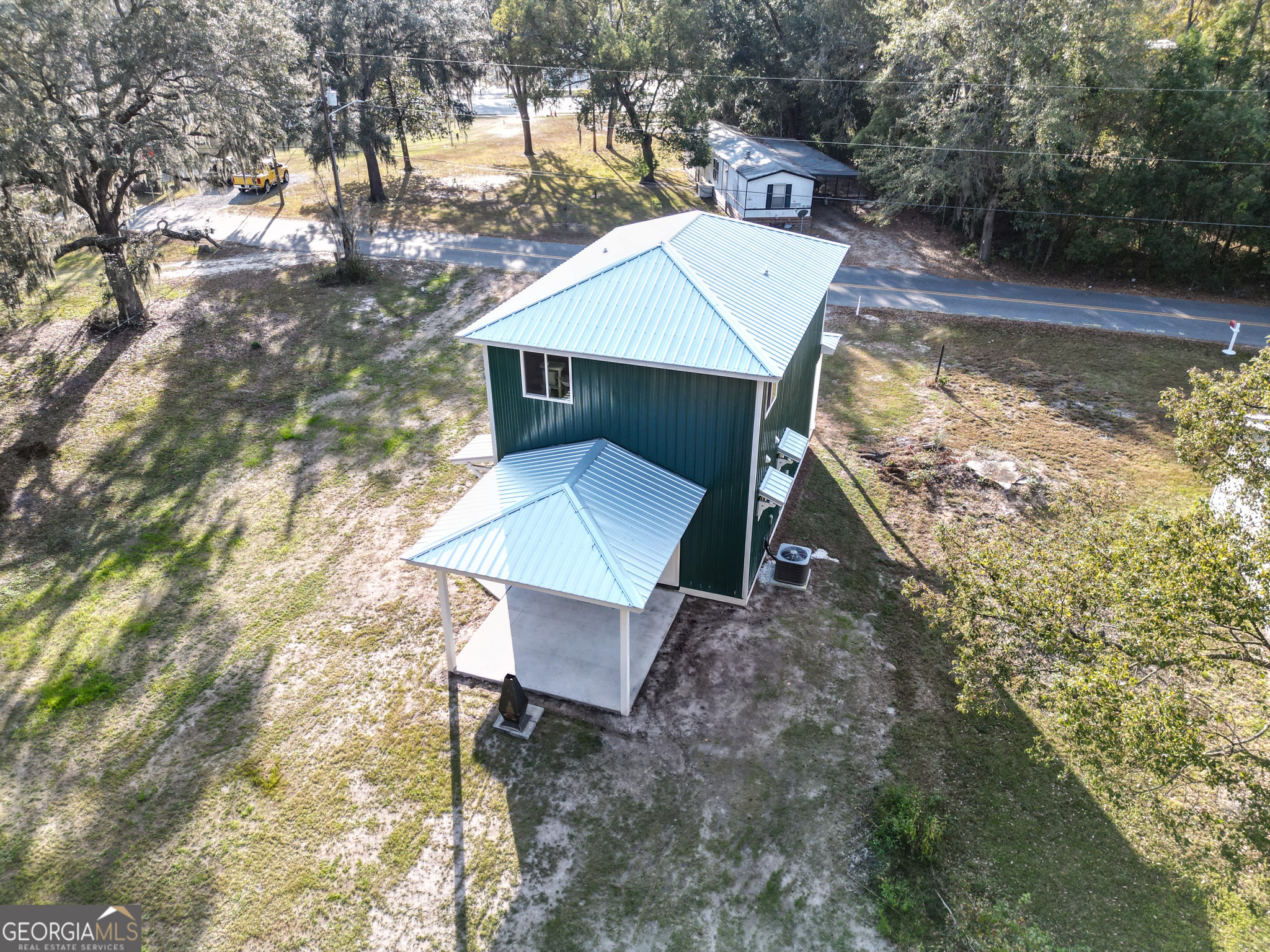 180 South Main Street Ludowici, GA 31316 - Photo 35 of 43 a view of a patio with chair and table