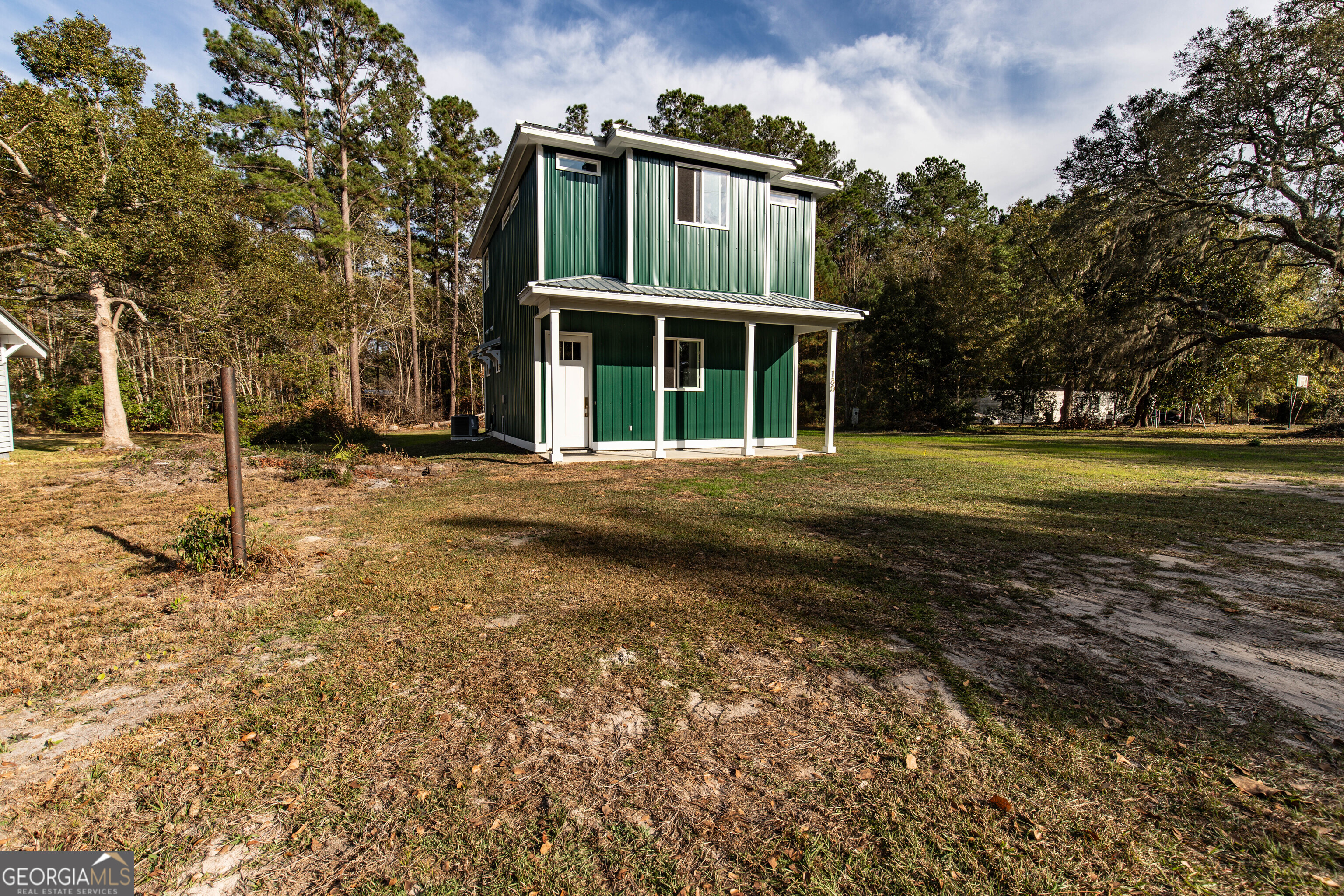 180 South Main Street Ludowici, GA 31316 - Photo 37 of 43 a front view of a house with a yard
