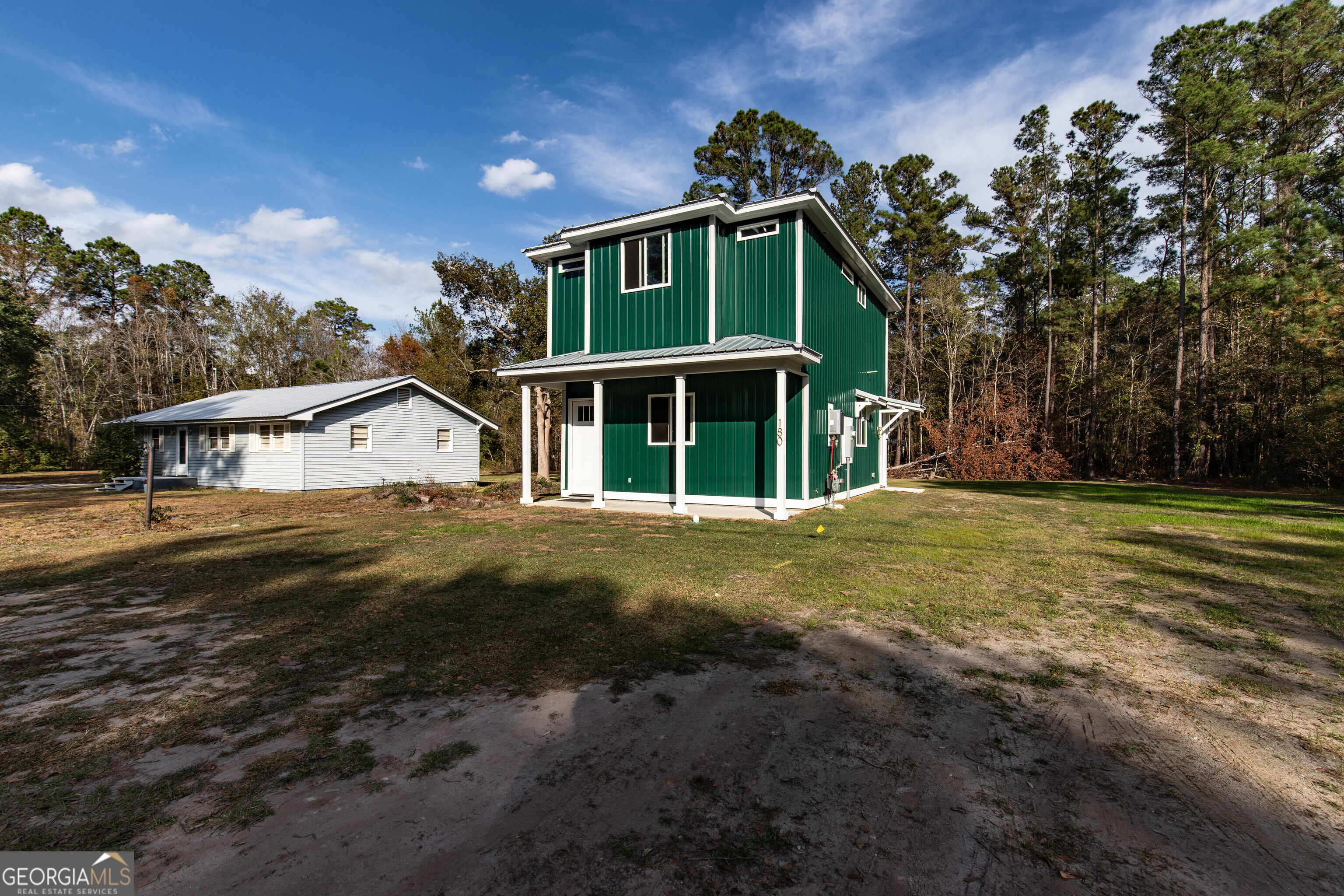 180 South Main Street Ludowici, GA 31316 - Photo 38 of 43 a front view of a house with a yard