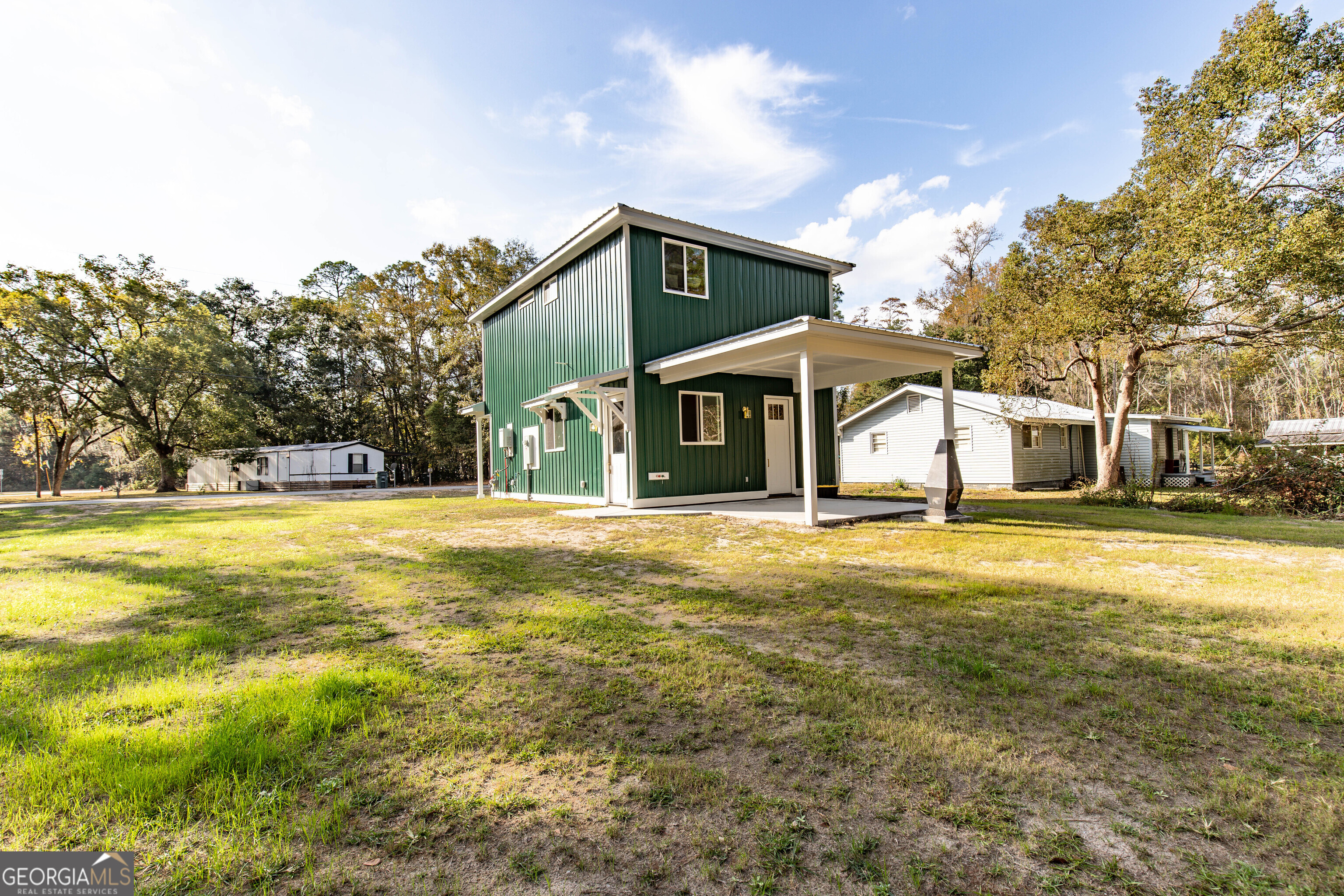 180 South Main Street Ludowici, GA 31316 - Photo 39 of 43 a front view of a house with a yard