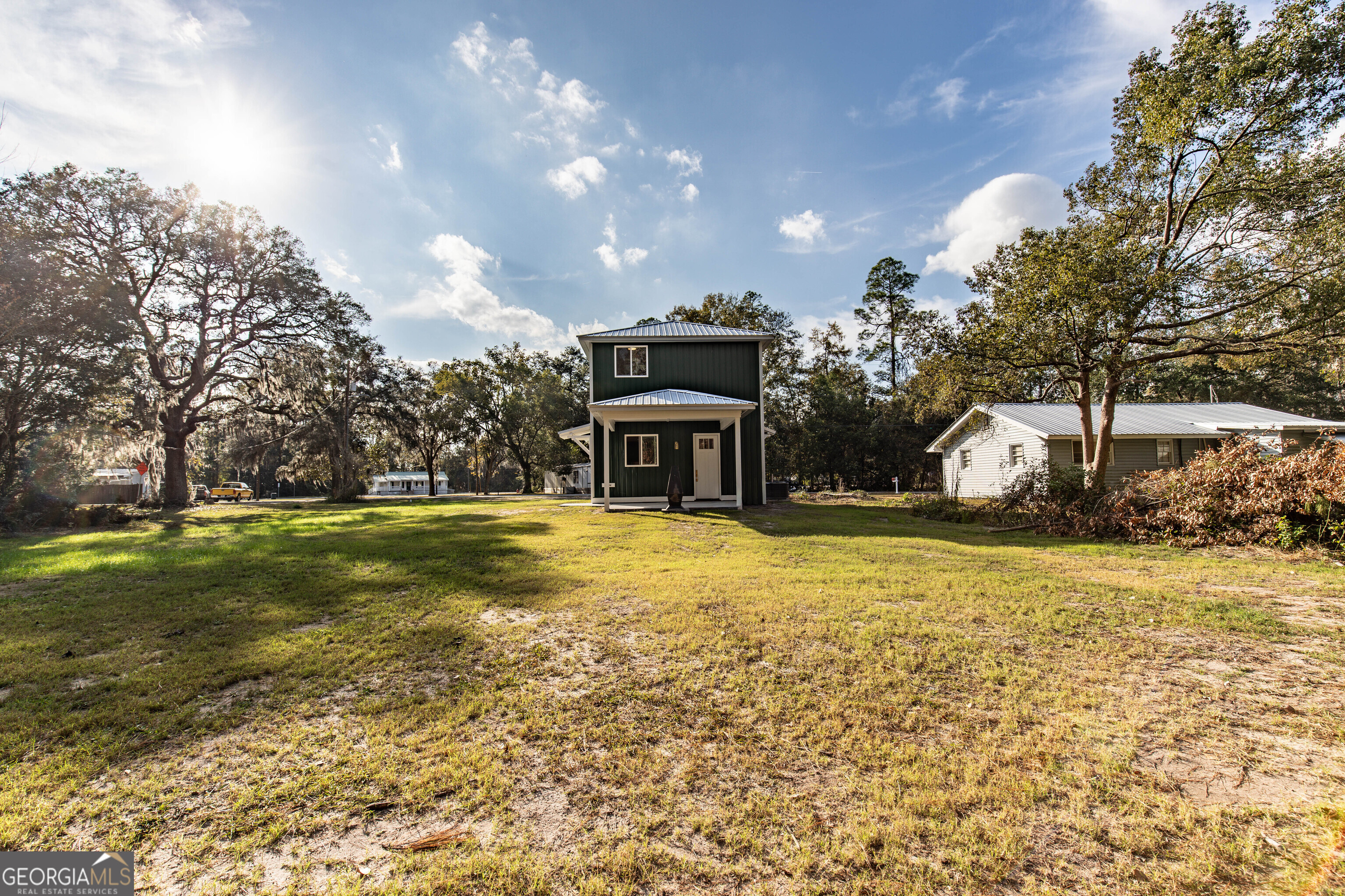 180 South Main Street Ludowici, GA 31316 - Photo 40 of 43 a front view of house with yard and trees