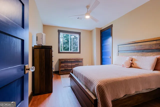 a bedroom with a bed and a dresser