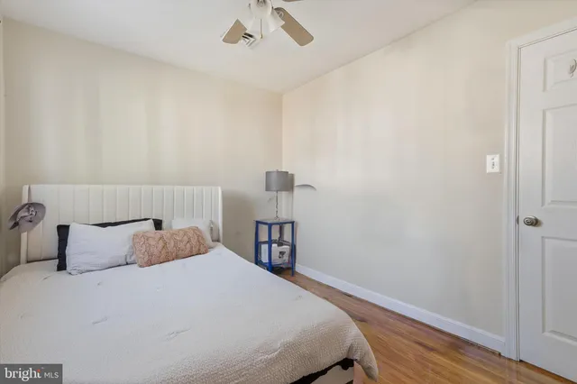 a bedroom with a bed and a table