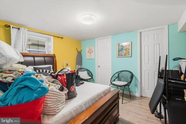 a bedroom with bed and a window