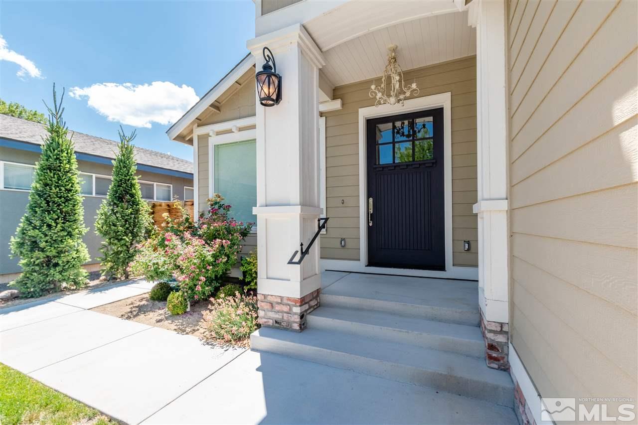 1663 Shangri-La Drive Reno, NV 89509 - Photo 3 of 30 a front view of a house with a yard