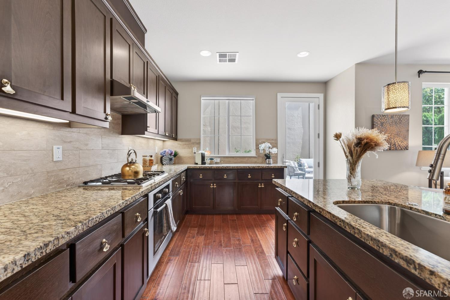 360 Gerald Circle Milpitas, CA 95035 - Photo 11 of 46 a kitchen with a sink stove top oven and cabinets