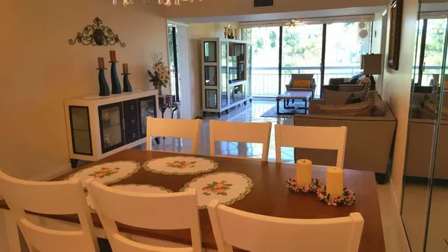a view of a dining room with furniture window and outside view