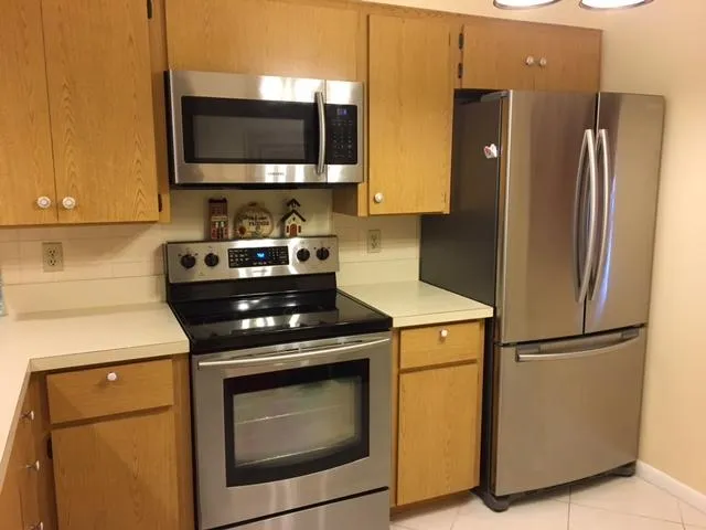 a kitchen with a stove and a refrigerator
