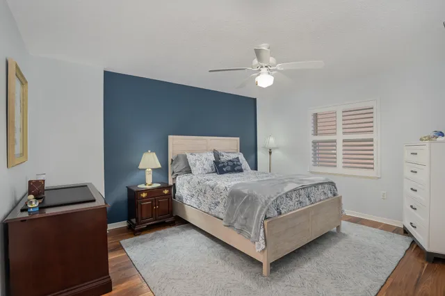 a bed room with a bed and a window