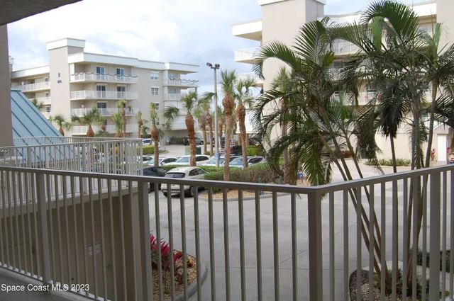 a view of a balcony with a pot