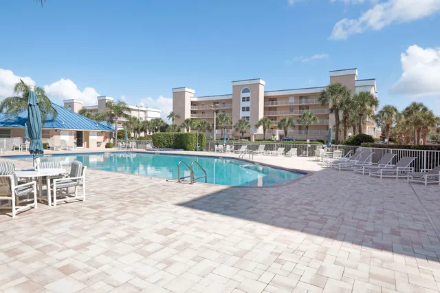 a view of multiple houses with a street