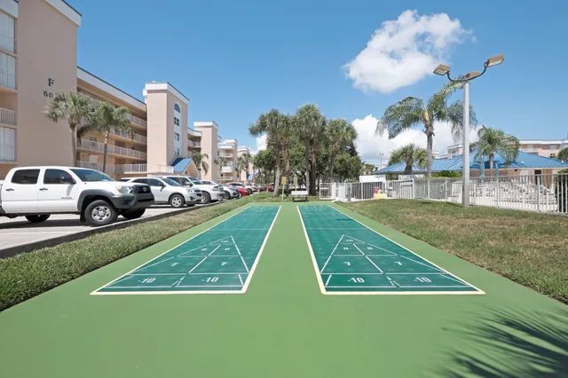 a view of city and ocean from a balcony