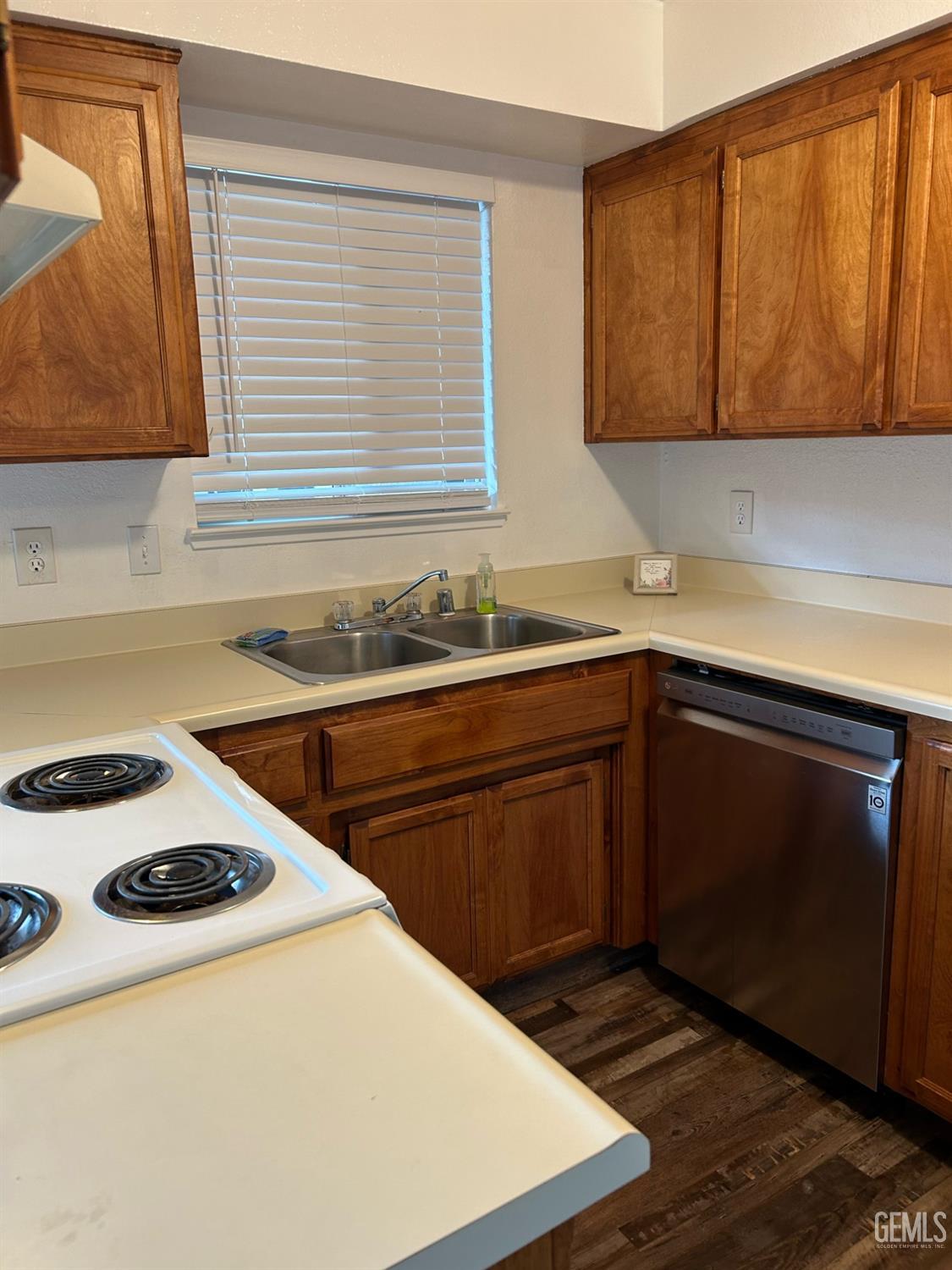 Undisclosed Address Bakersfield, CA 93309 - Photo 3 of 12 a kitchen with a sink a stove and cabinets