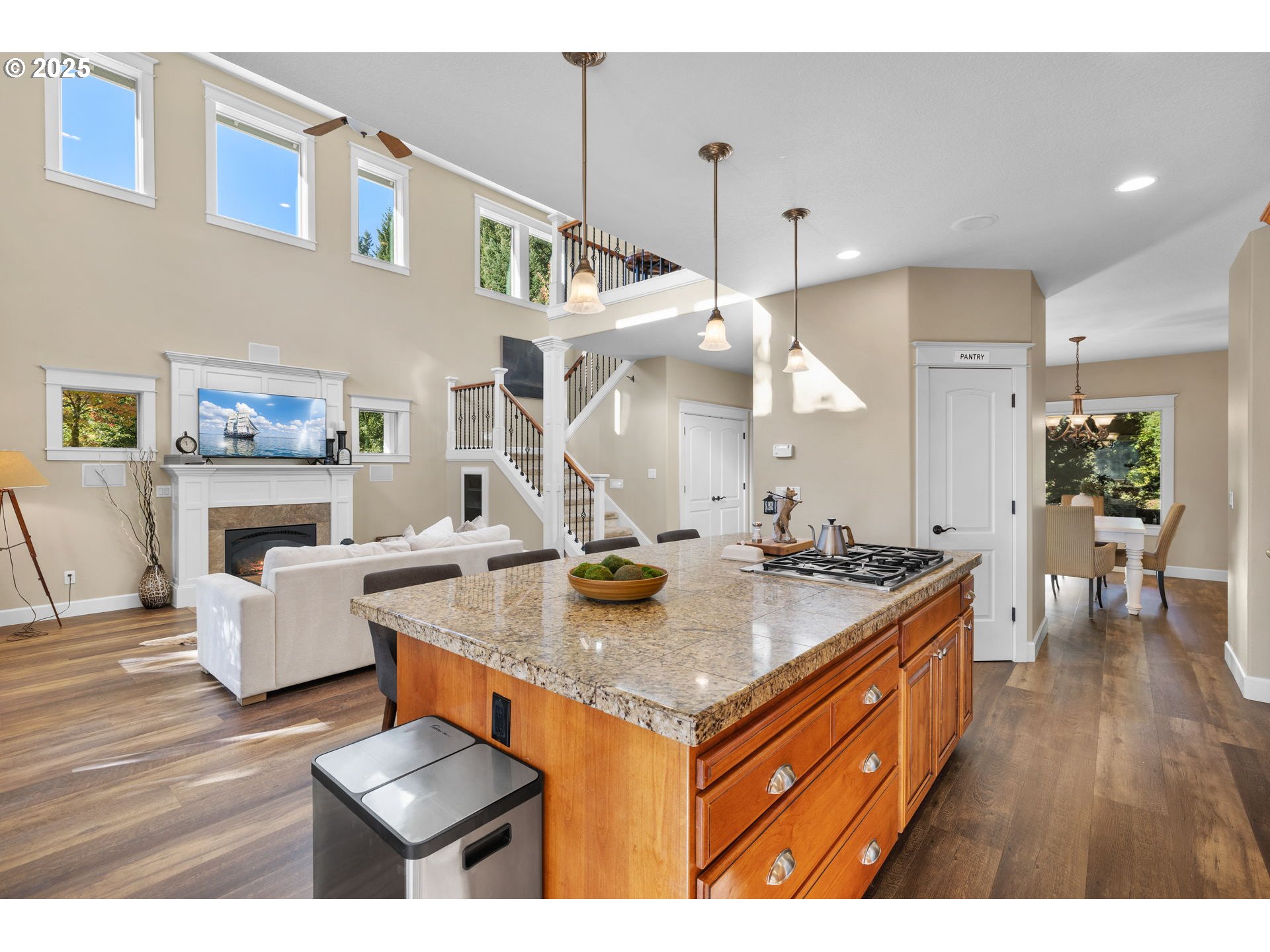 30010 Northeast 60th Street Camas, WA 98607 - Photo 19 of 48 a kitchen with a stove a refrigerator and a dining table