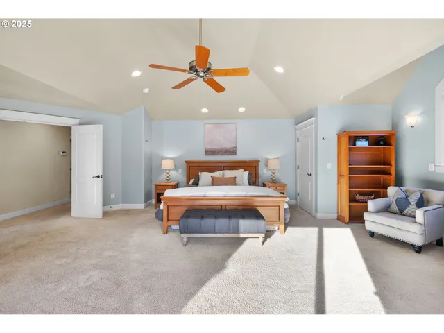 a bedroom with a large bed and a couch