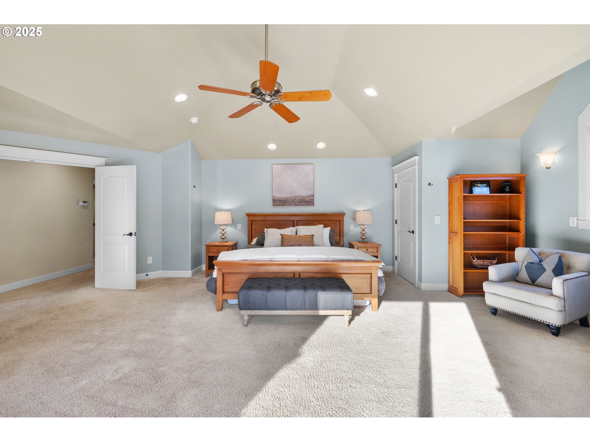 30010 Northeast 60th Street Camas, WA 98607 - Photo 28 of 48 a bedroom with a large bed and a couch