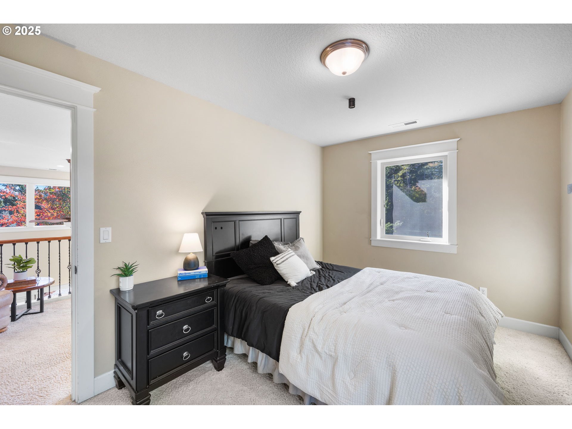 30010 Northeast 60th Street Camas, WA 98607 - Photo 34 of 48 a bedroom with a bed and a painting on the wall