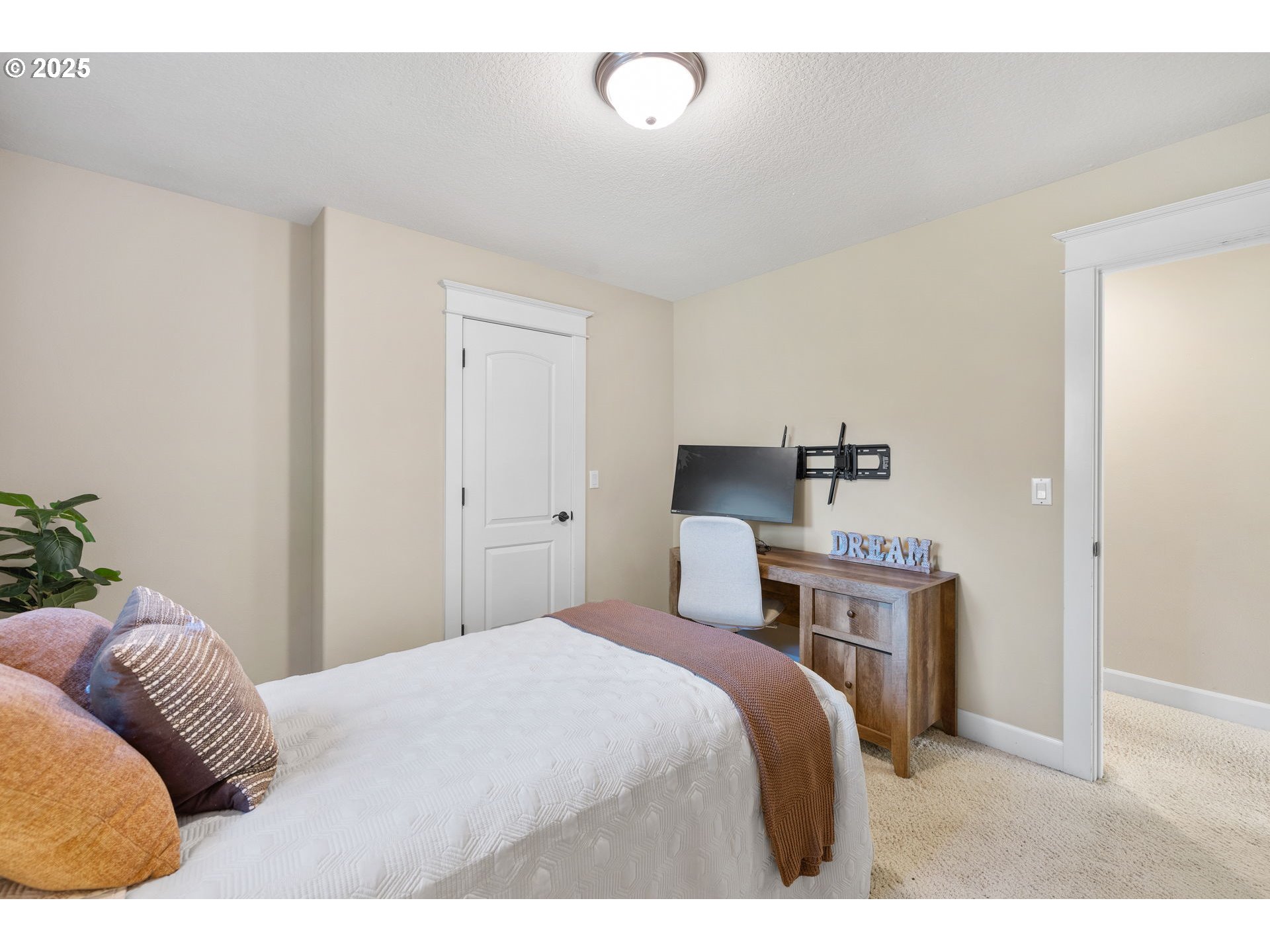 30010 Northeast 60th Street Camas, WA 98607 - Photo 37 of 48 a bedroom with a bed and painting on the wall