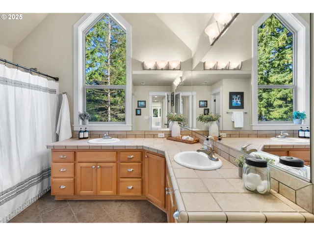 a bathroom with a sink double vanity and a mirror
