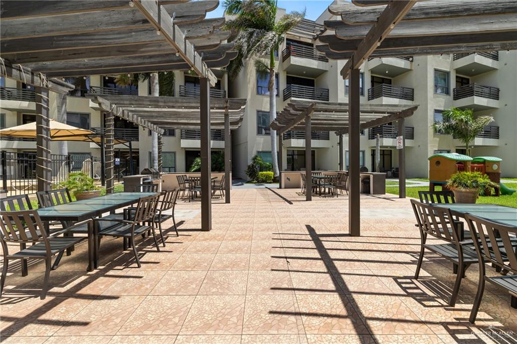 813 Travis Street, Unit 203 Mission, TX 78572 - Photo 23 of 30 a view of a building with sitting area