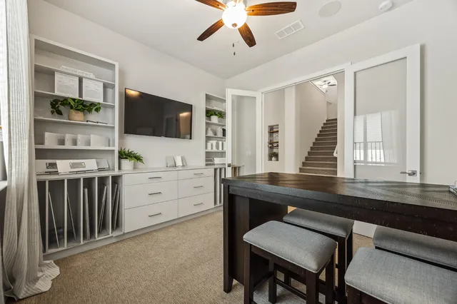 a kitchen with stainless steel appliances white cabinets stove and sink