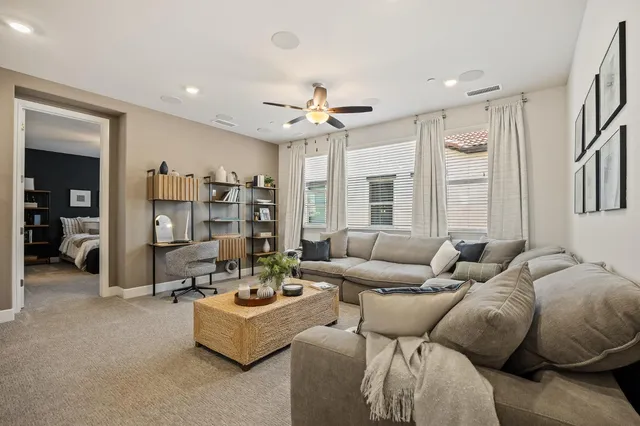 a living room with furniture and a large window
