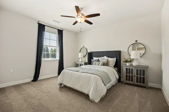 a bedroom with a bed and window