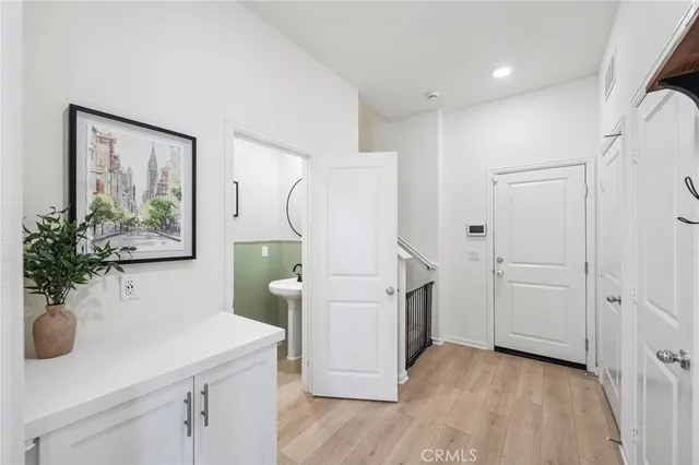 a view of kitchen with furniture and wooden floor