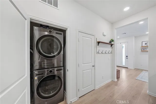 a view of a hallway with washer and dryer