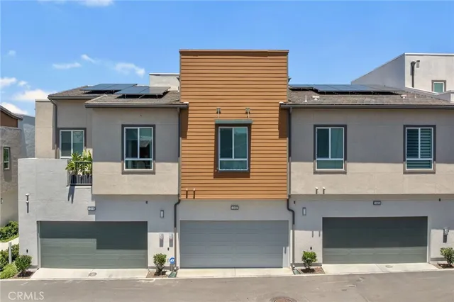 a front view of a house with garage