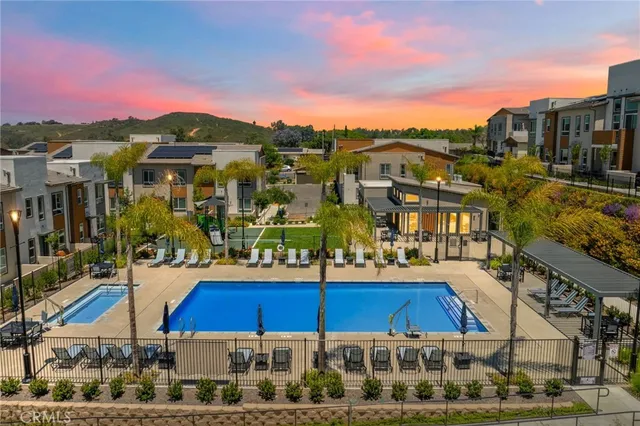 a view of multiple houses with a street