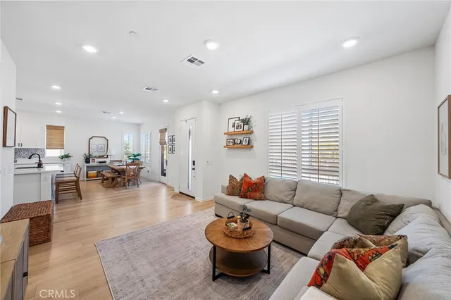 a living room with furniture and a table