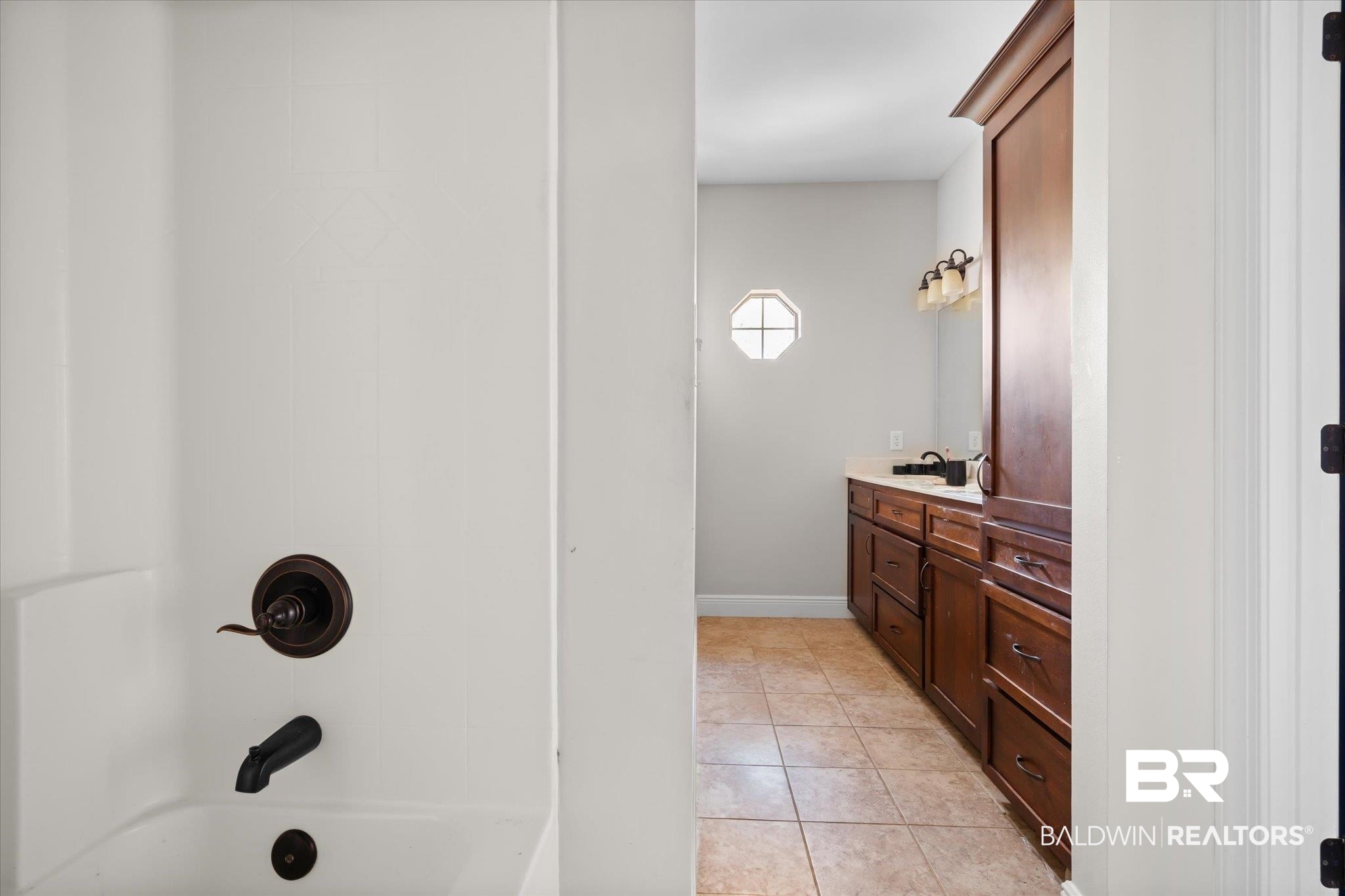 20792 Lonnie Walker Road Citronelle, AL 36522 - Photo 11 of 19 Bathroom with vanity, tile patterned floors, and shower / bath combination