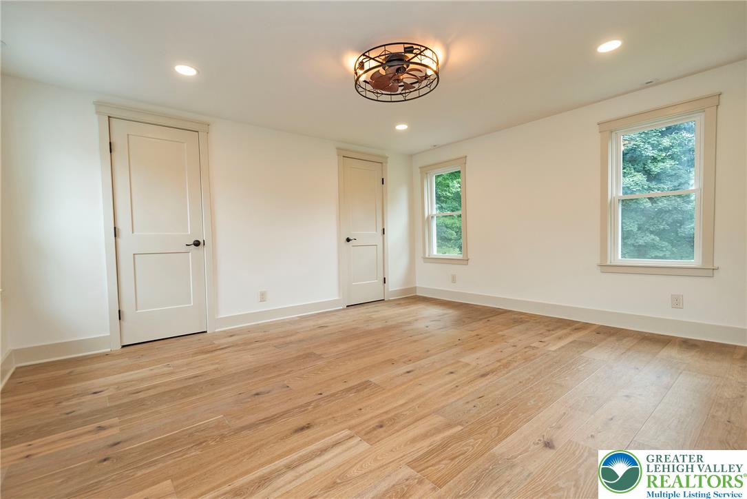 72 Allegheny Road Mount Bethel, PA 18343 - Photo 29 of 72 Blonde wood flooring and recessed lighting illuminate this adaptable bedroom space.
