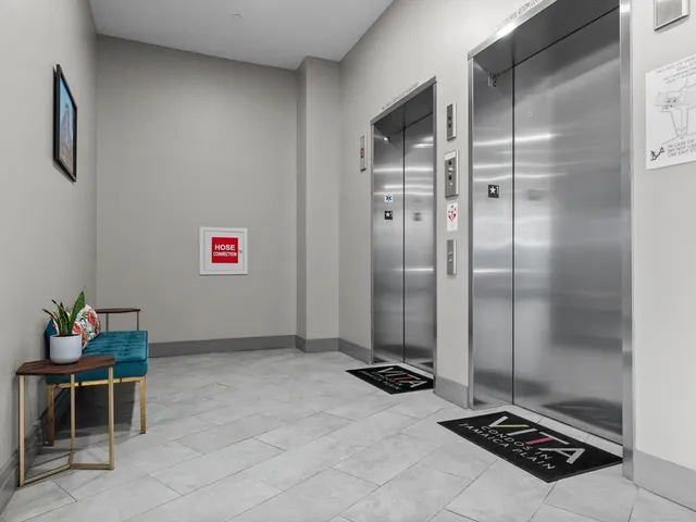 a work room with furniture and a flat screen tv