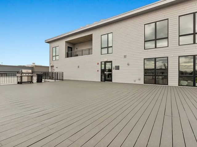 a view of workspace with wooden floor stairs and cabinet