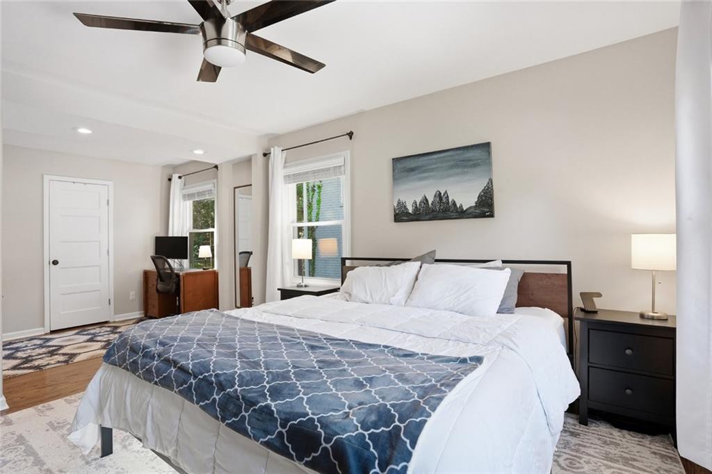 1430 Thomas Road Decatur, GA 30030 - Photo 16 of 42 a bedroom with a large bed and a chandelier