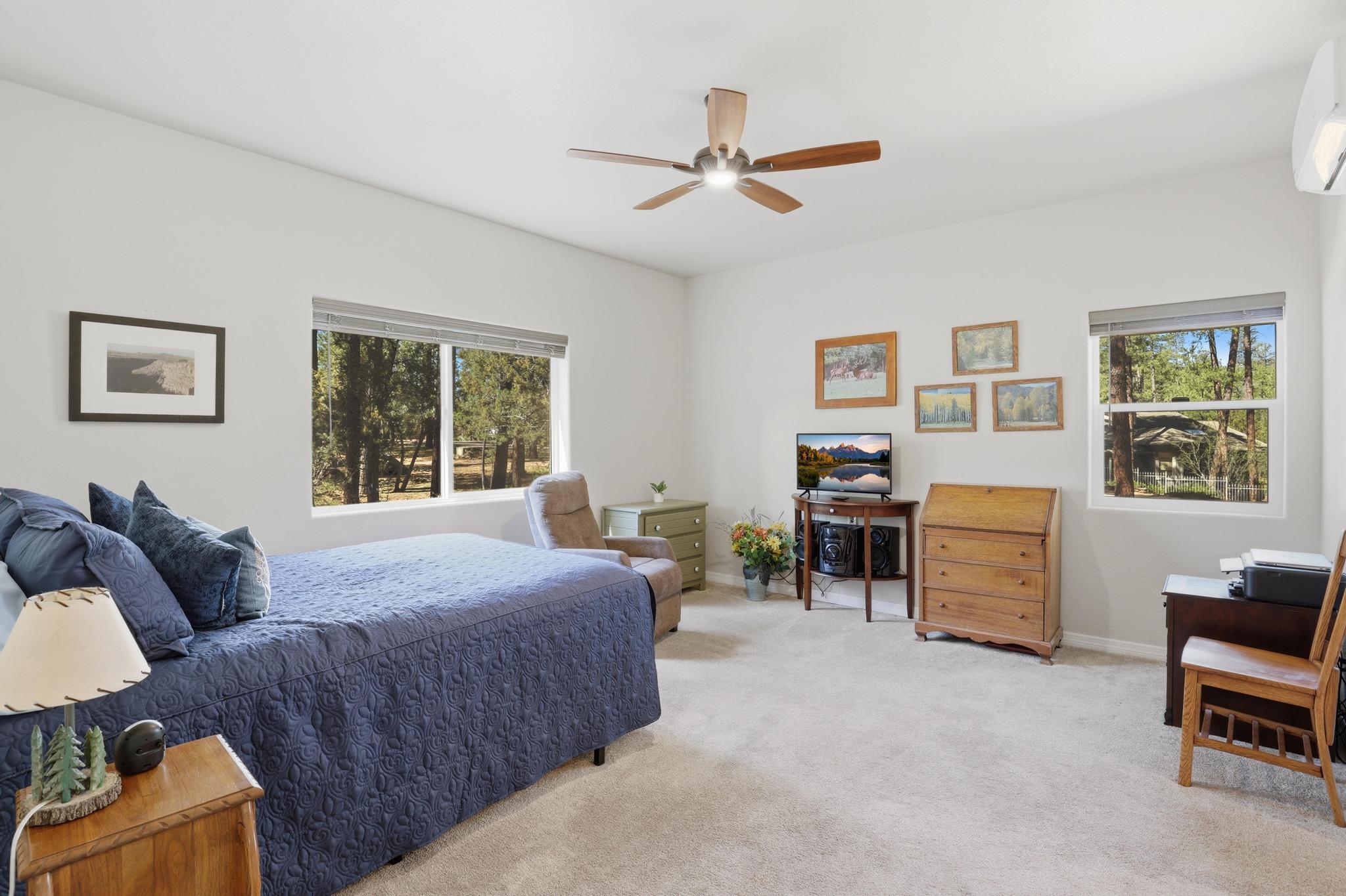 5501 Solitude Trail Loop Pine, AZ 85544 - Photo 21 of 27 a bedroom with furniture and windows
